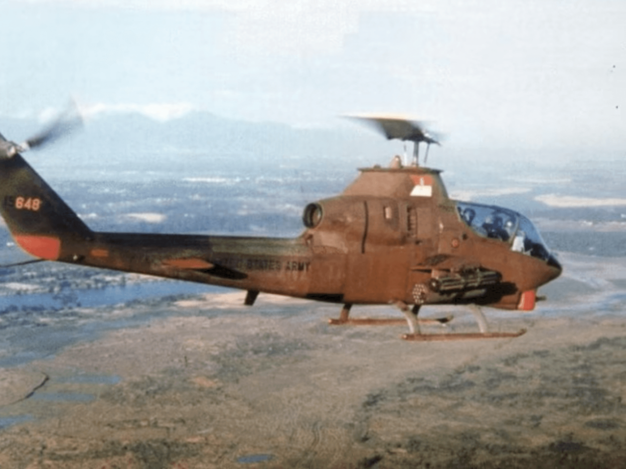 A helicopter in flight, taken from another aircraft presumably.