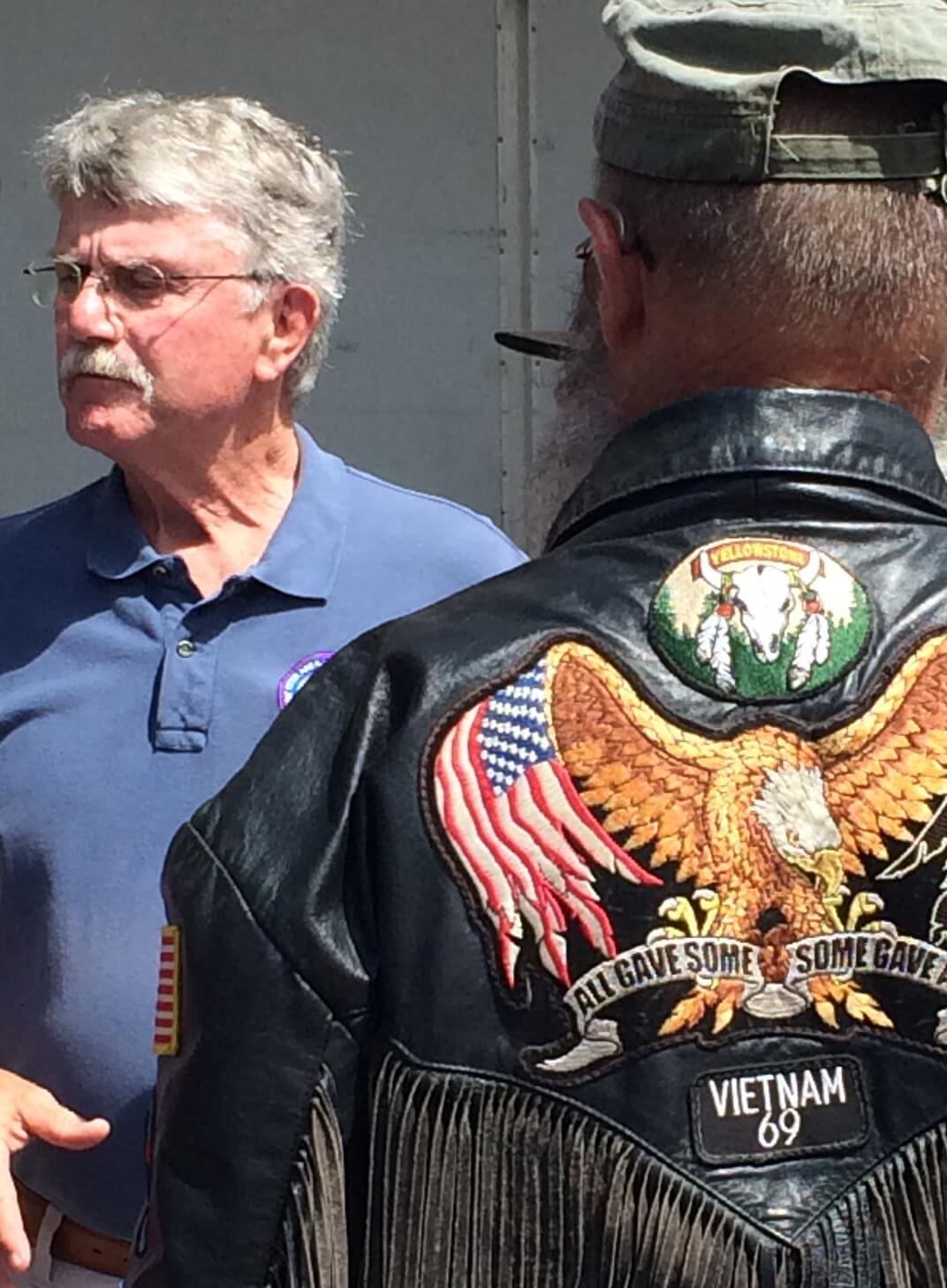 Man in a fringed Vietnam veteran jacket.