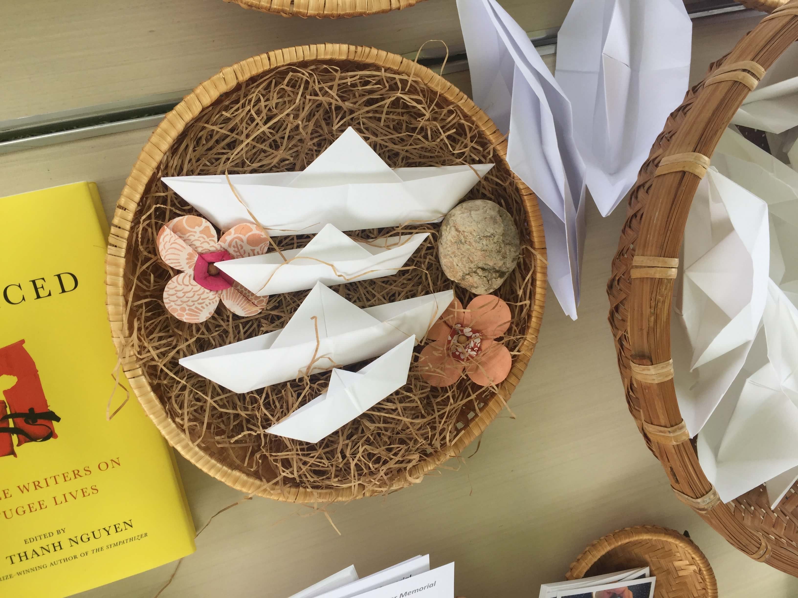 Basket with three white paper folded boats.