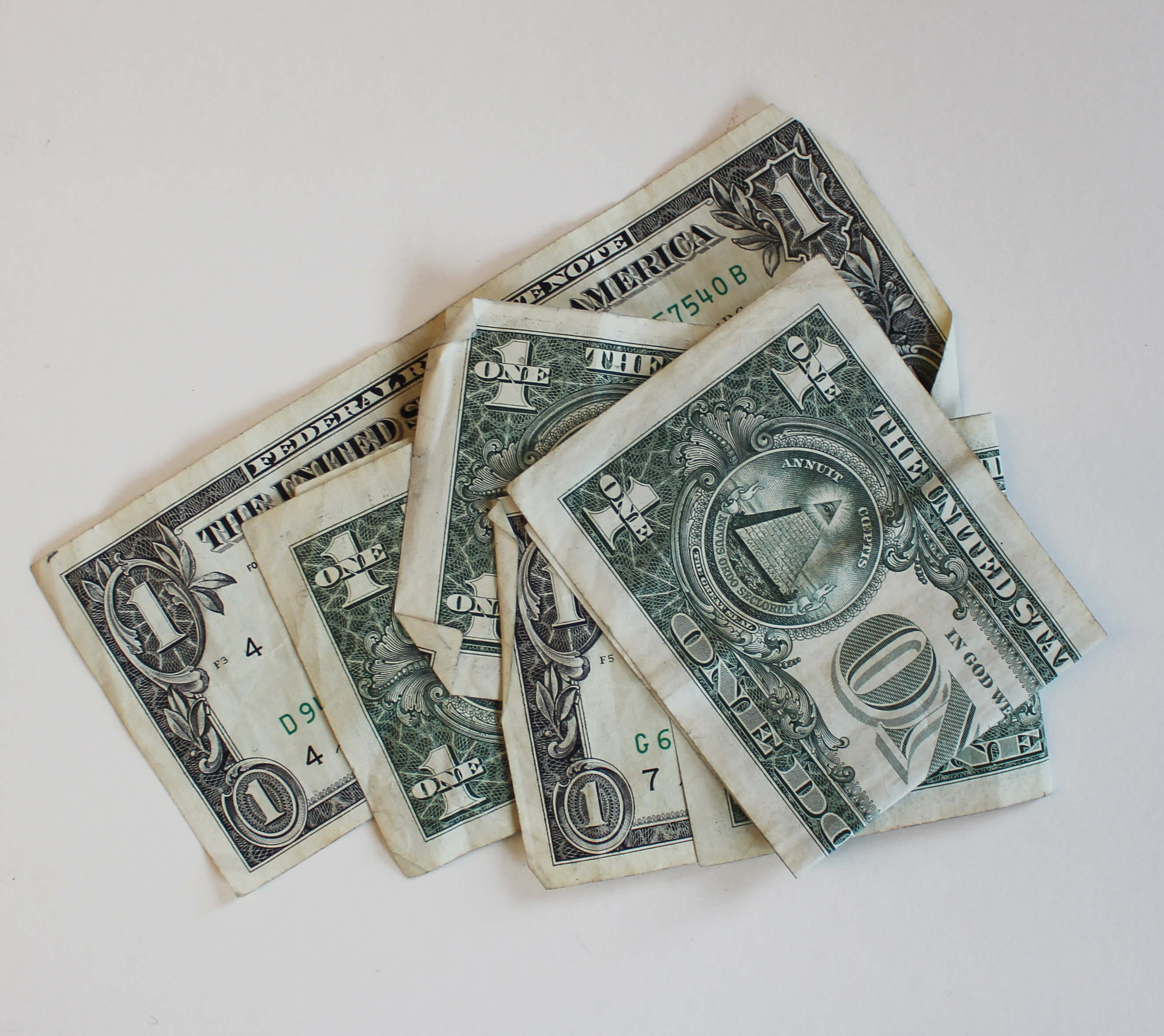 Five U.S. one dollar bills