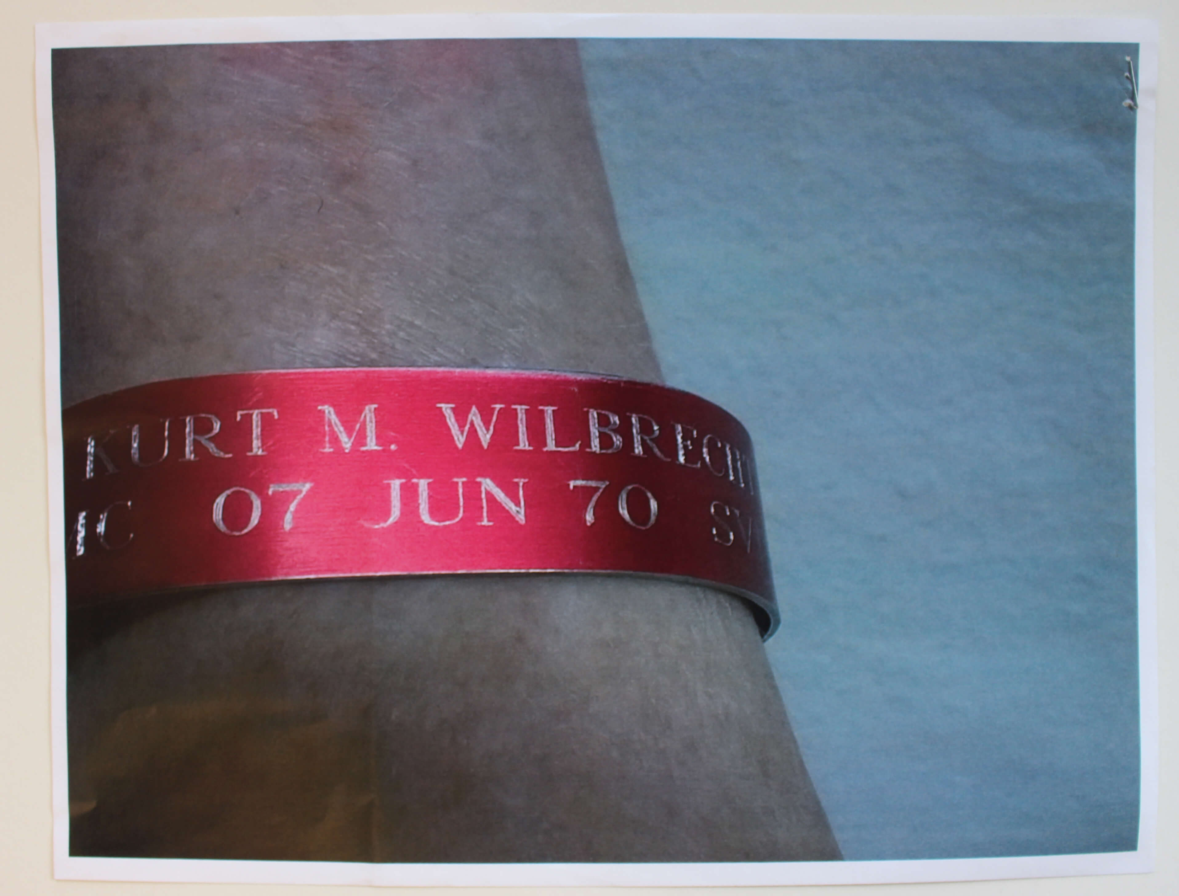 Red bracelet with the name Kurt M. Wilbrecht engraved in it