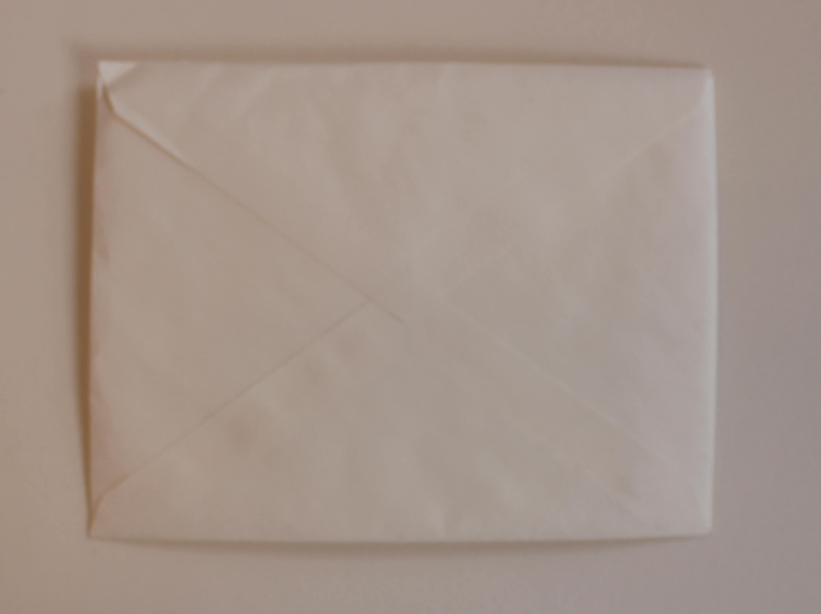 Back of unopened white envelope