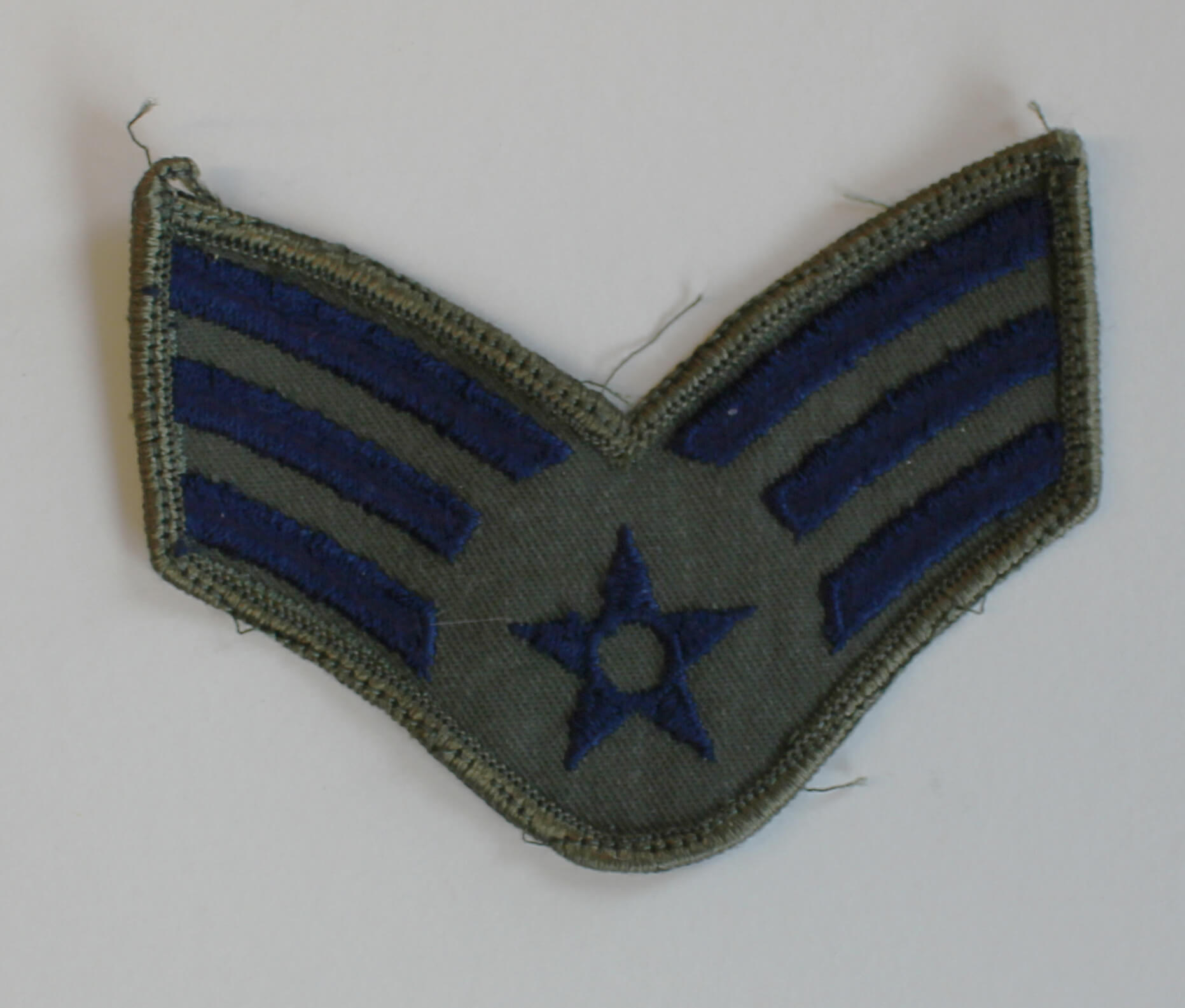 Green and blue military patch with star in center