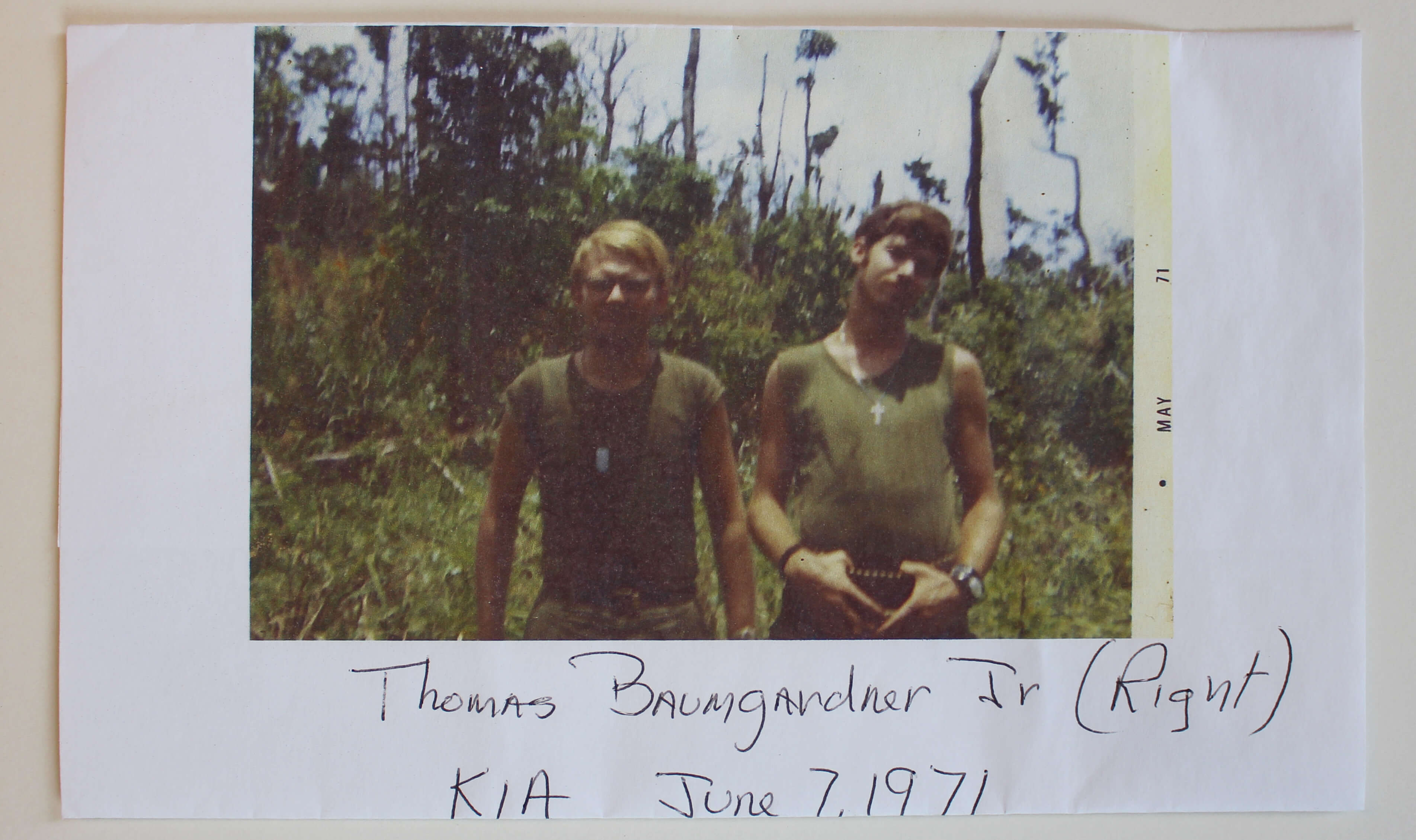 Portrait of two young soldiers with text Thomas Baumgardner Jr. KIA June, 1971.