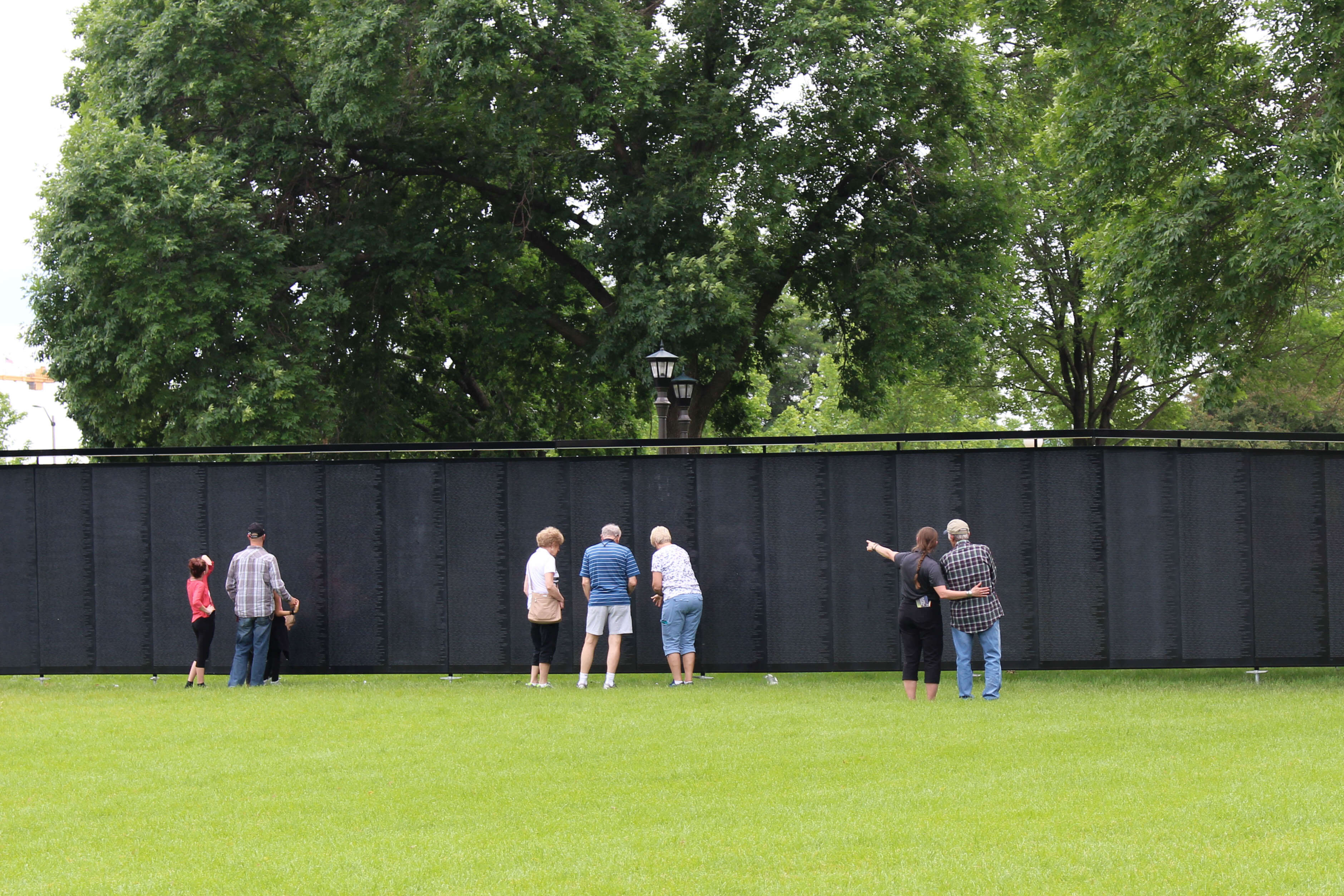 grassy field and replica of the Vietnam Wall.