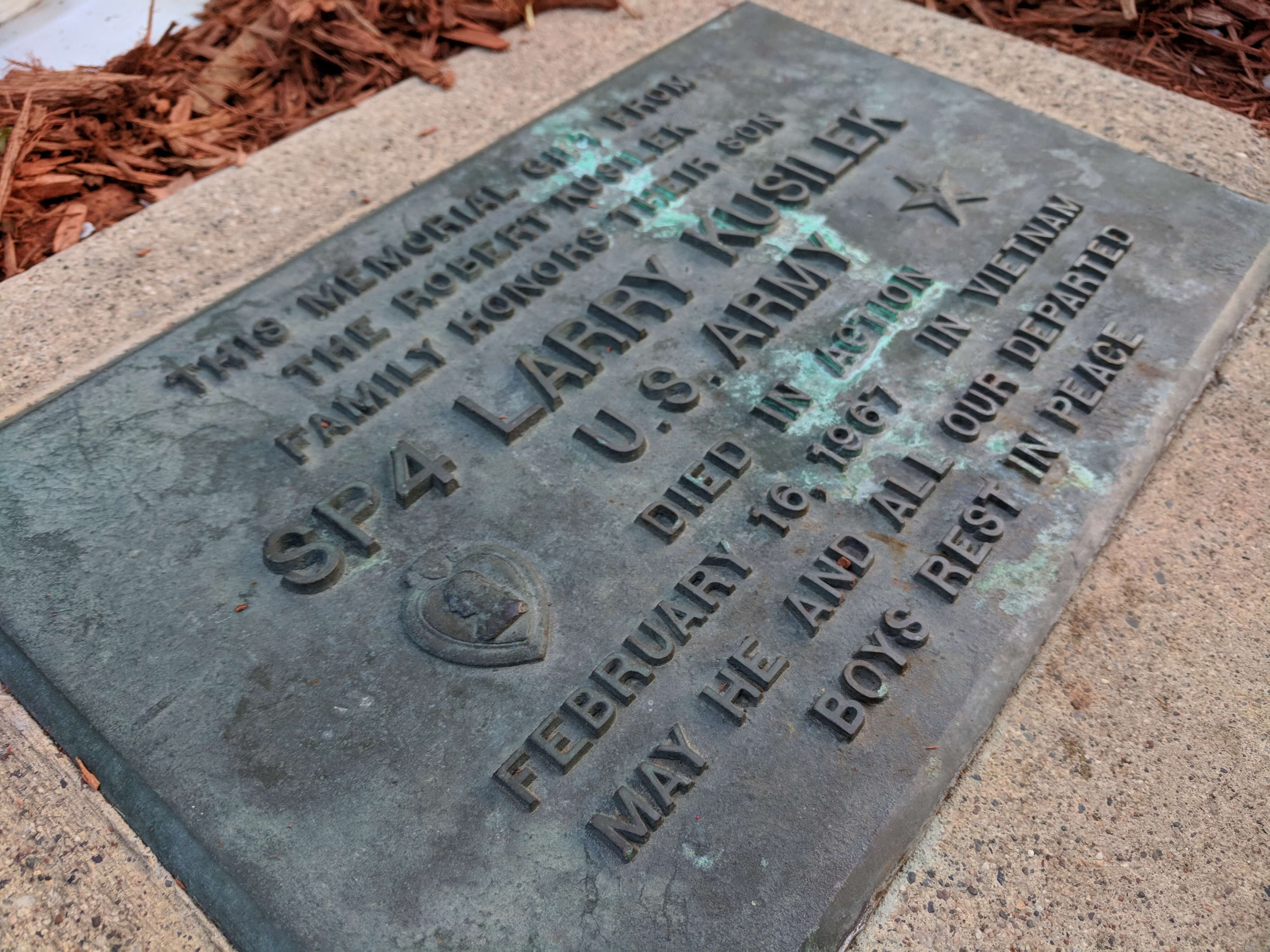 Bronze memorial plaque honoring Larry Kusilek who died during the Vietnam War.