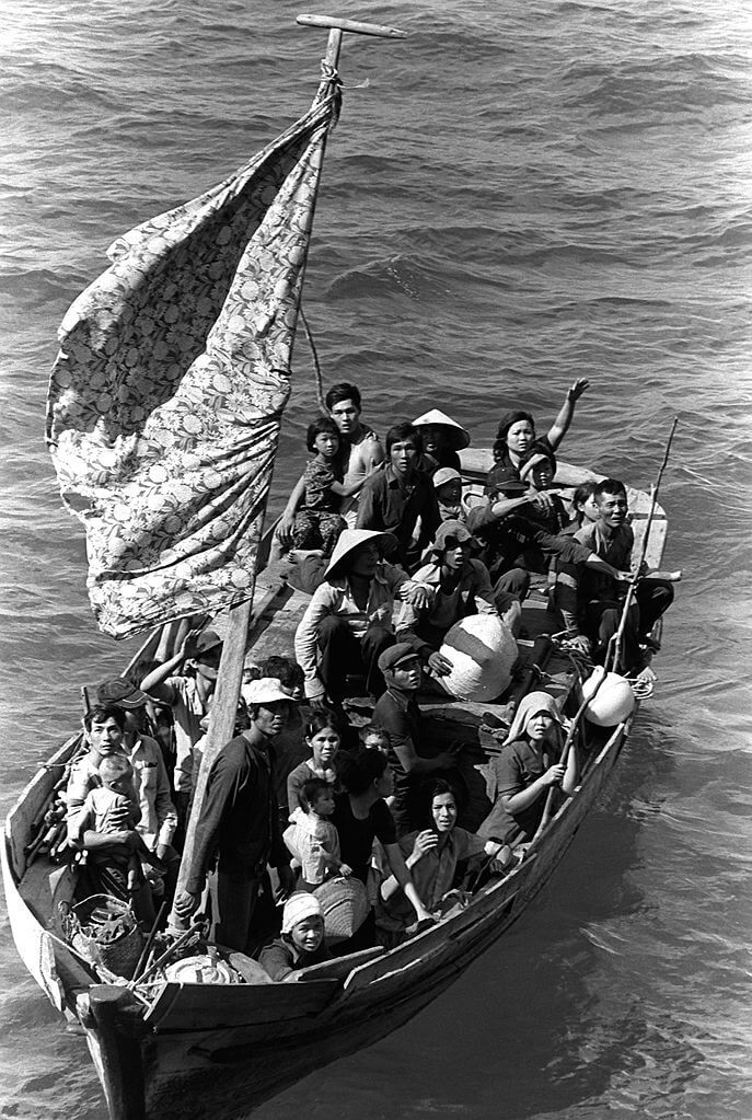 Black and white photo of Vietnamese Boat People being rescued