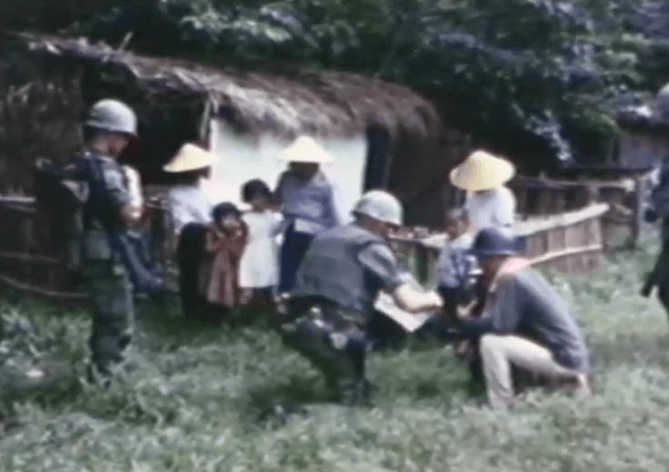 Vietnam soldiers talking to local people