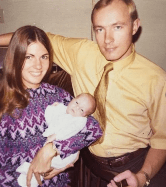 Parents holding a newborn baby