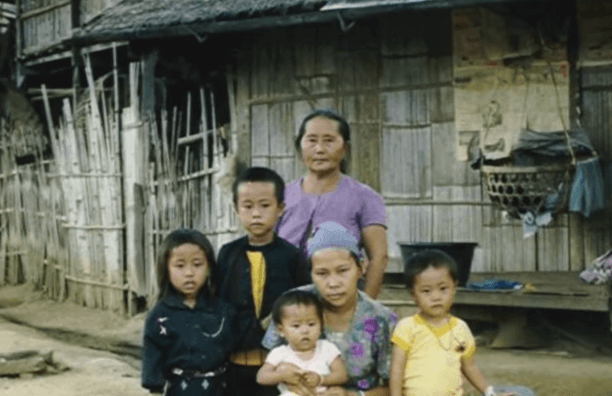 Group of Hmong children with grandmother