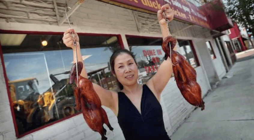 Vietnamese woman selling ducks