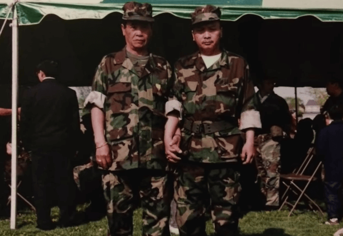 Two Hmong soldiers in camoflauge