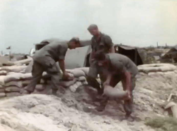 Soldiers moving sandbags in Vietnam