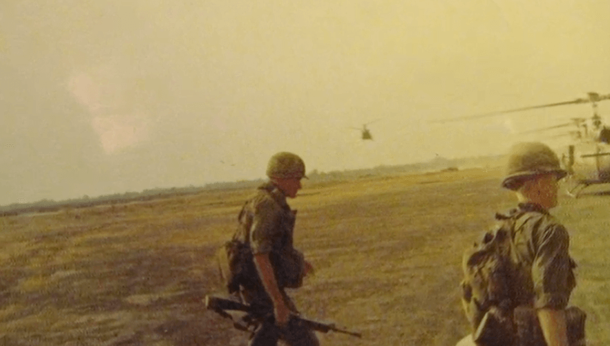 Soldier walking with gun during the Vietnam War