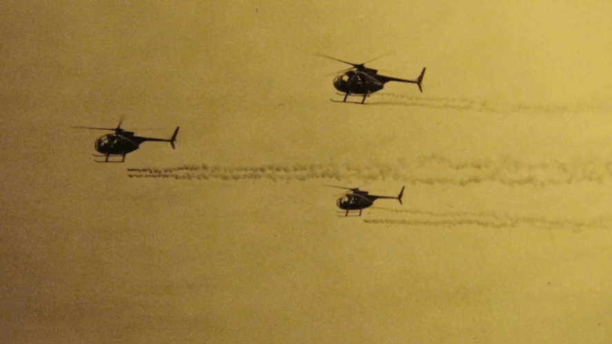 Three Huey Helicopters in flight