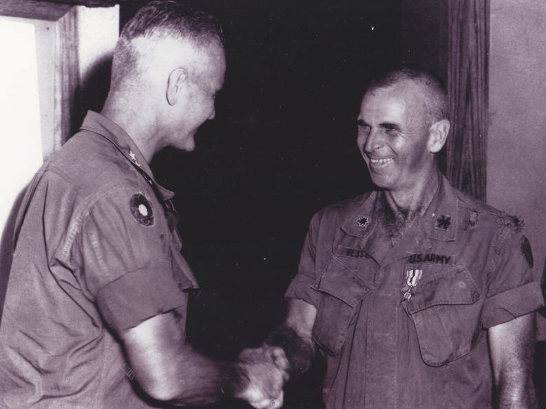 Two soldiers shaking hands